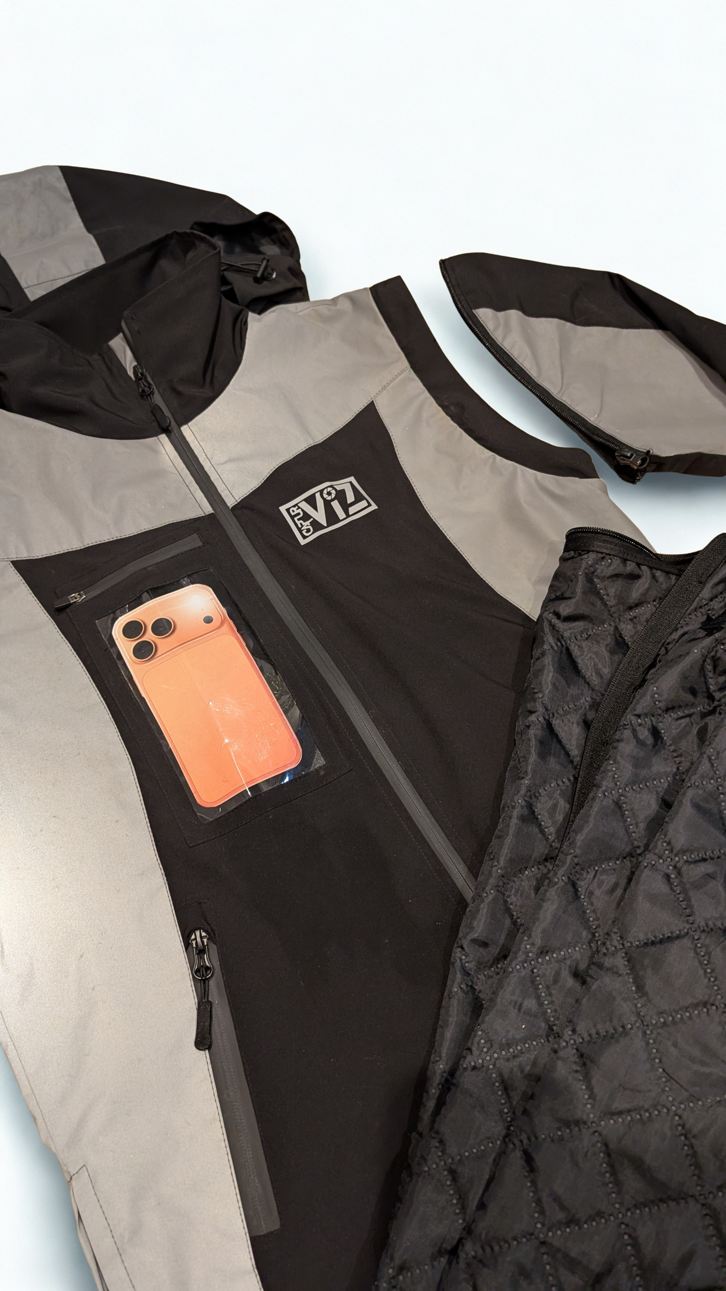 Preorder Now: The CapturViz Reflect/Deflect  3-in-1 Coat - Reflective, Water & Windproof, Versatile 3 Ways To Wear, Removable Liner & Sleeves, POV Clear Phone Pocket, Hidden Back Pack & Hood, Waterproof Zips.
